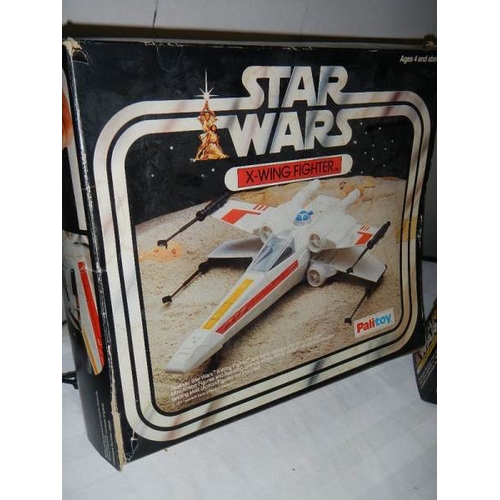 288 - A boxed Palitoy Star Wars Land Speeder and X wing fighter, (unchecked for completeness and in played... 