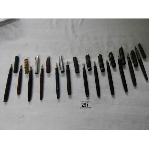 297 - A good collection of fountain pens (4 with gold nibs) and a quantity of ball point pens.