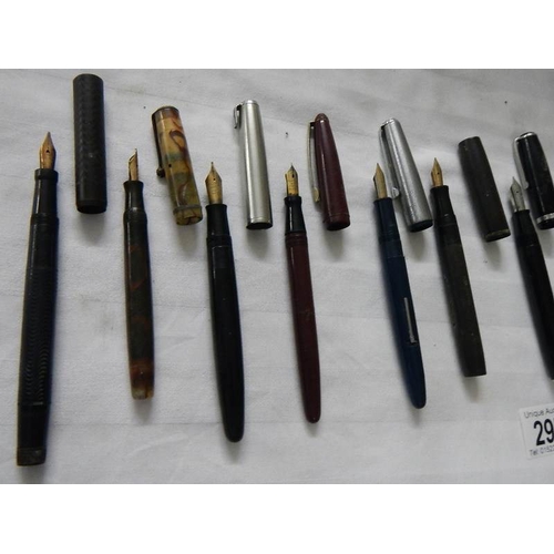 297 - A good collection of fountain pens (4 with gold nibs) and a quantity of ball point pens.