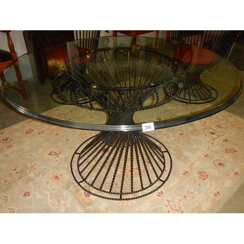 298 - A top quality designer glass top table and 4 matching chairs.