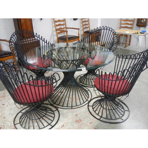 298 - A top quality designer glass top table and 4 matching chairs.