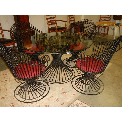 298 - A top quality designer glass top table and 4 matching chairs.