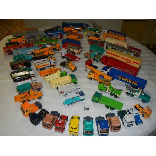 299 - In excess of 60 cars and lorries, die cast and plastic.