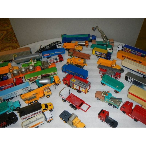 299 - In excess of 60 cars and lorries, die cast and plastic.