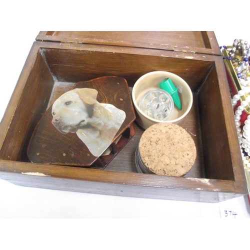 374 - A tin of costume jewellery and a wooden box and contents