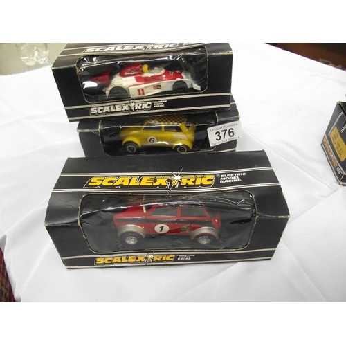 376 - 6 boxed Scalextric cars including Mini TR7 etc. In used condition, boxes a/f