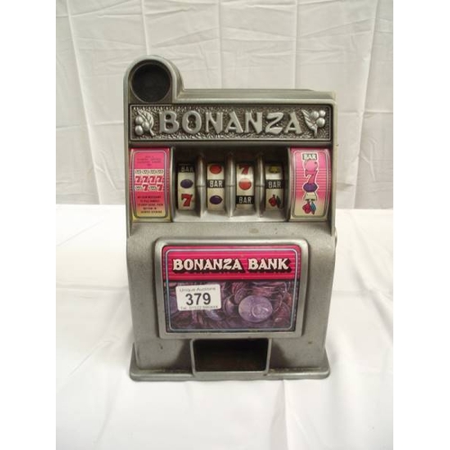 379 - A vintage miniature Toy Bonanza Bank 1 arm bandit with metal front. i.w.o. 29cm tall at highest poin... 