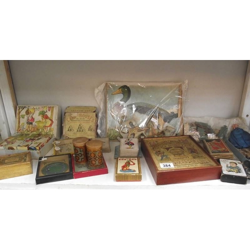 384 - A shelf of vintage puzzles, games, jigsaws, cards etc. (completeness of jigsaws unknown)