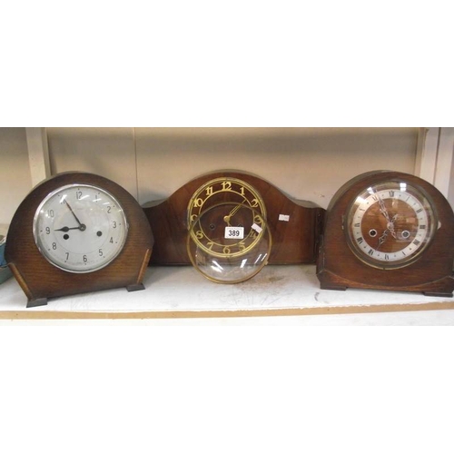 389 - Three 1930's oak mantle clocks (glass on 1 is loose)