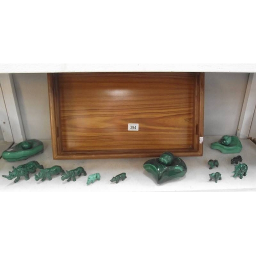 394 - A collection of green malacite animals etc. and a wooden tray