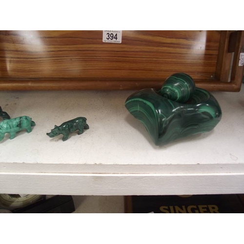 394 - A collection of green malacite animals etc. and a wooden tray