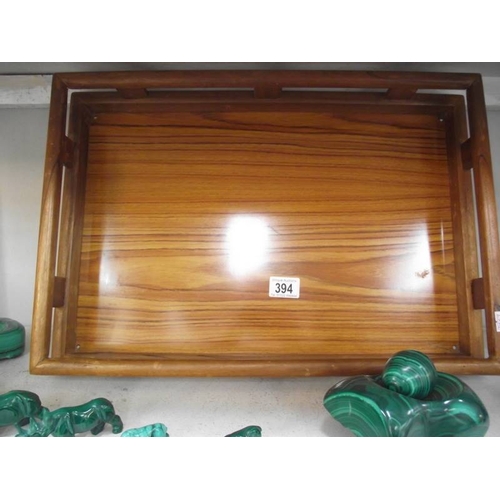 394 - A collection of green malacite animals etc. and a wooden tray