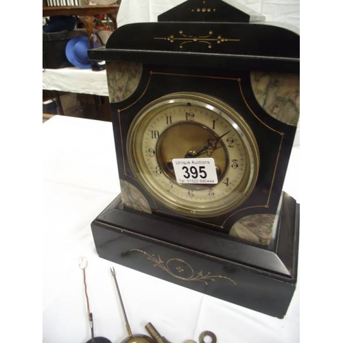 395 - A black slate mantel clock