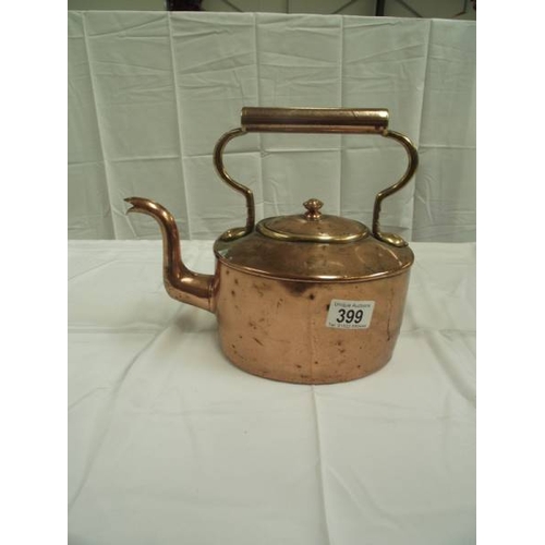 399 - A vintage copper kettle