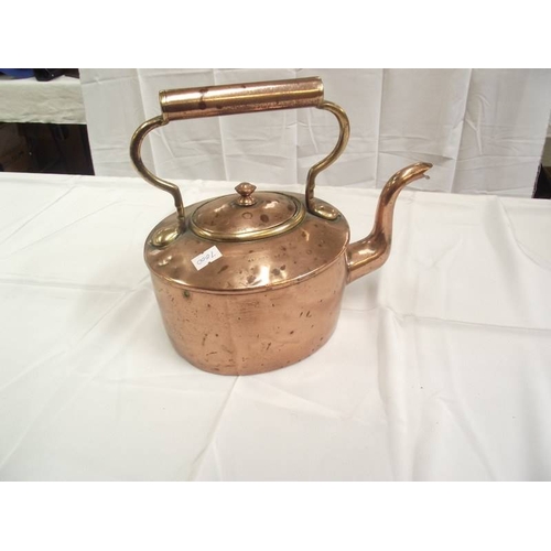 399 - A vintage copper kettle