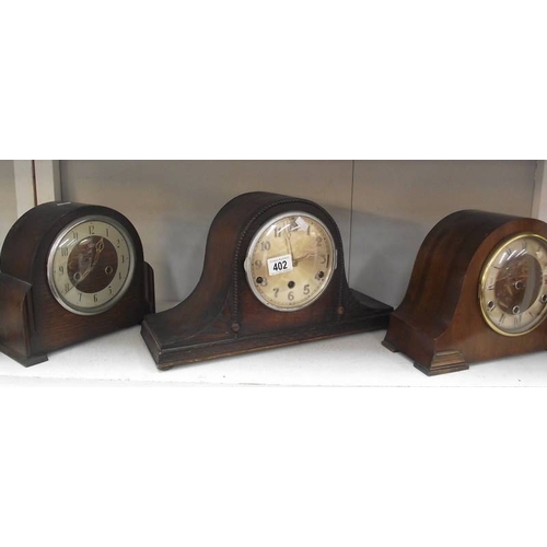 402 - Three 1930's oak mantle clocks