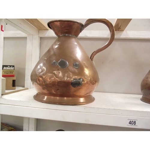 408 - A set of seven graduated copper ale jugs