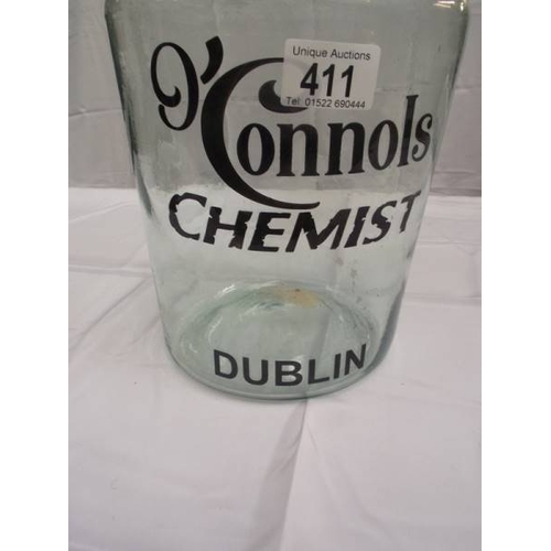 411 - A glass bottle jar with O'Connols chemist Dublin advertising lettering