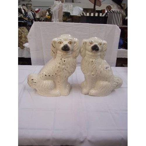 417 - A pair of vintage Staffordshire mantlepiece dogs