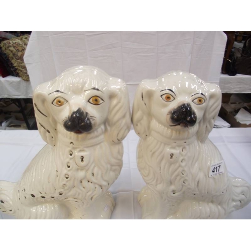 417 - A pair of vintage Staffordshire mantlepiece dogs