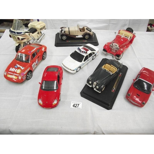 427 - 8 large scale die cast and plastic cars including Burago, Maistro etc.,