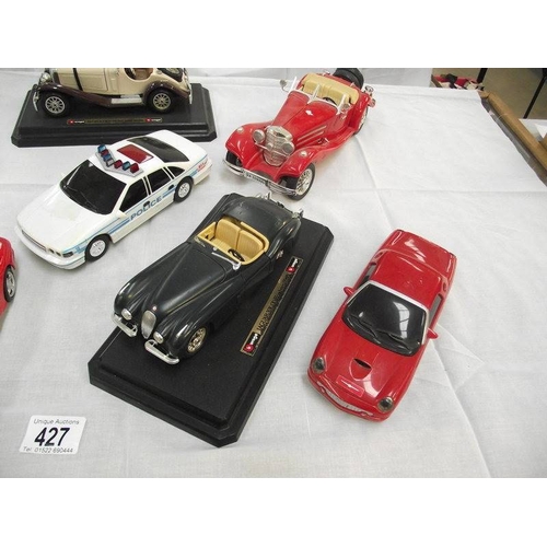 427 - 8 large scale die cast and plastic cars including Burago, Maistro etc.,