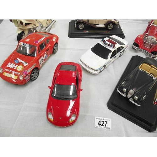 427 - 8 large scale die cast and plastic cars including Burago, Maistro etc.,