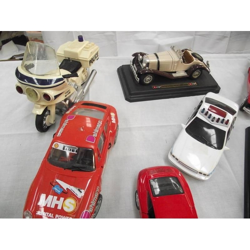 427 - 8 large scale die cast and plastic cars including Burago, Maistro etc.,