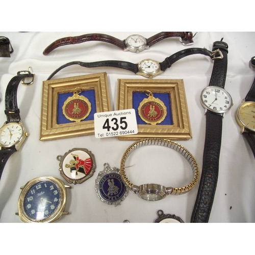 435 - A quantity of watches and dancing medals