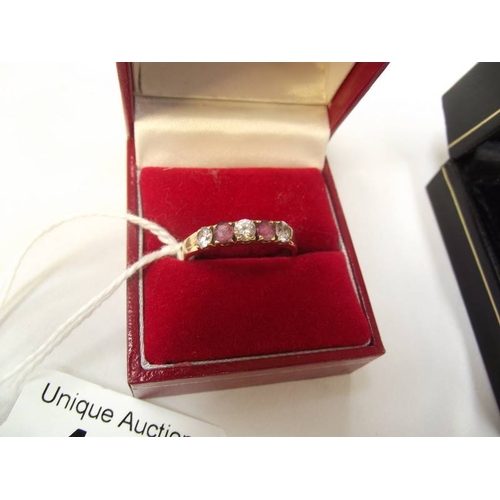 438 - A 9ct gold ring set stones 2.7g size V and a pair of silver cufflinks and matching tiepin