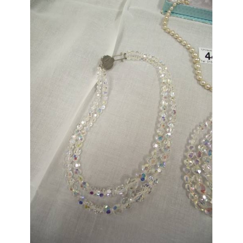 440 - 2 crystal necklaces and a pearl necklace