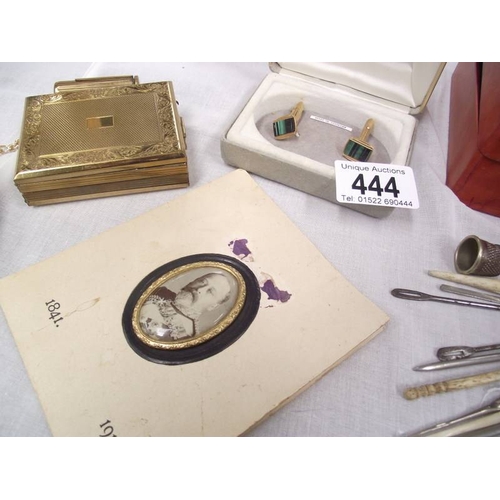 444 - A pair of malacite cufflinks, cigarette lighters, leather box, sewing implements etc.