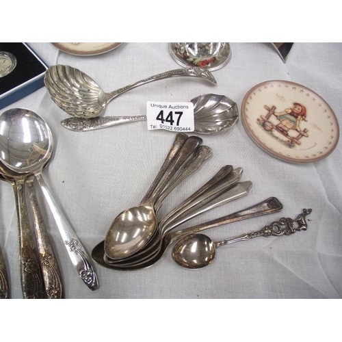 447 - A mixed lot including s/p spoons, Hummel plates, Hummel picture paperweight, German music box, silve... 