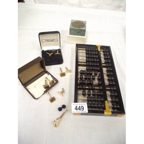 449 - An abacus, calendar, selection of cufflinks and a tiepin