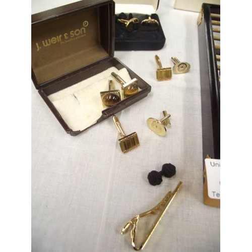 449 - An abacus, calendar, selection of cufflinks and a tiepin