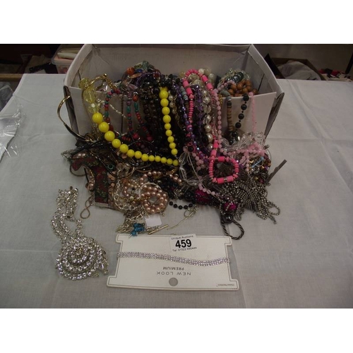 459 - A box of unsorted costume jewellery etc.