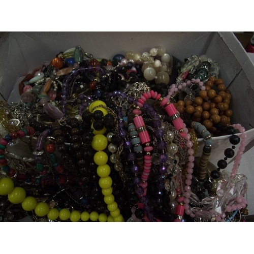 459 - A box of unsorted costume jewellery etc.