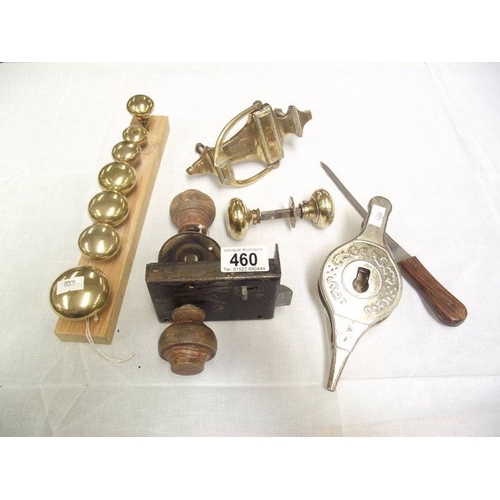 460 - A quantity of door knobs, door knocker etc.