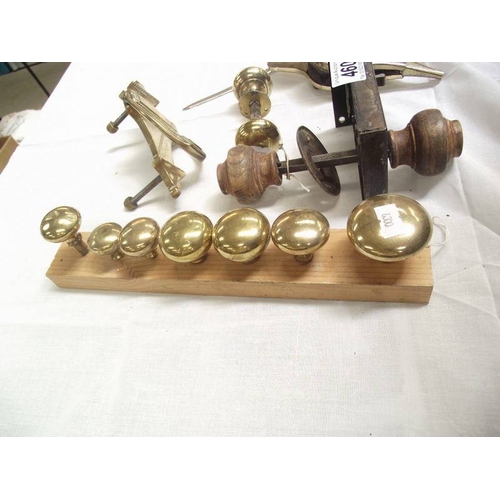 460 - A quantity of door knobs, door knocker etc.