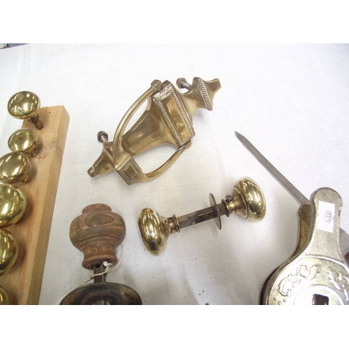 460 - A quantity of door knobs, door knocker etc.