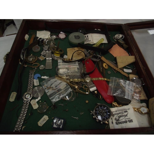 467 - A cabinet of watches and watch parts