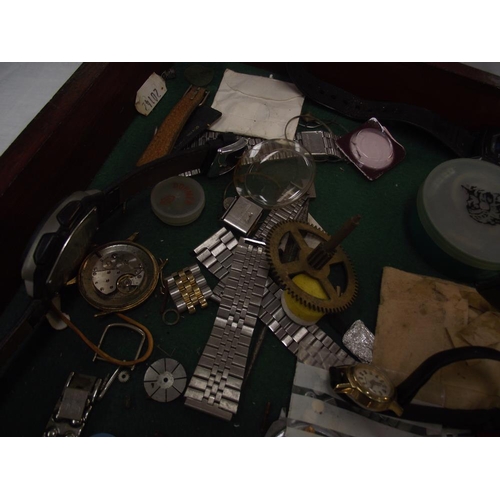 467 - A cabinet of watches and watch parts