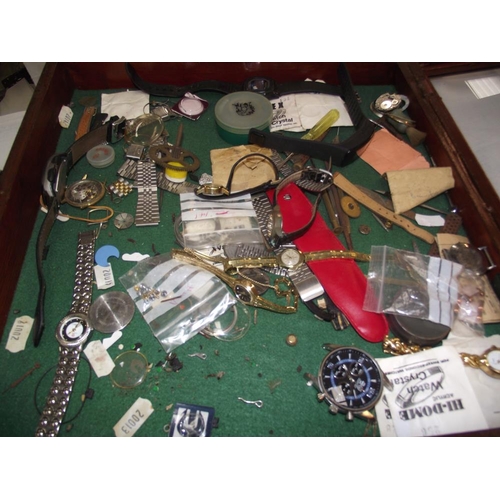 467 - A cabinet of watches and watch parts