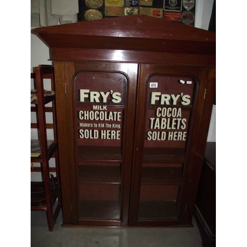 475 - A 2 door display cabinet with Frys Chocolate advertising to doors