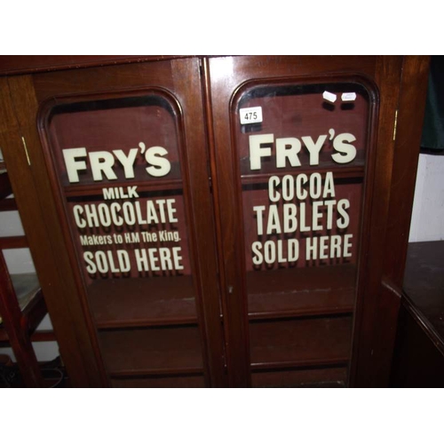 475 - A 2 door display cabinet with Frys Chocolate advertising to doors