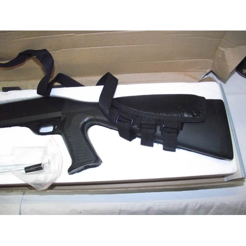 493 - A boxed Airsoft M56A Multi-Shot shotgun - Hop Up Version