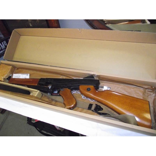 495 - A boxed Airsoft Thompson M1A1 submachine gun by Tokyo Marui Co Ltd