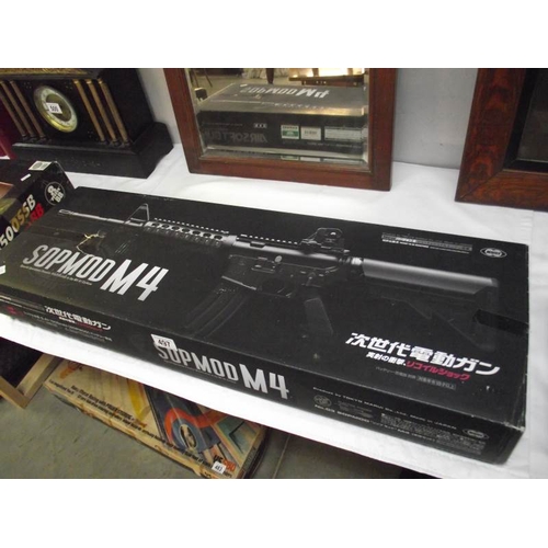 497 - A boxed Airsoft SOPMODM4 gun by Tokyo Marui Co Ltd. Please note magazine clip is missing and would n... 