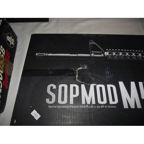 497 - A boxed Airsoft SOPMODM4 gun by Tokyo Marui Co Ltd. Please note magazine clip is missing and would n... 