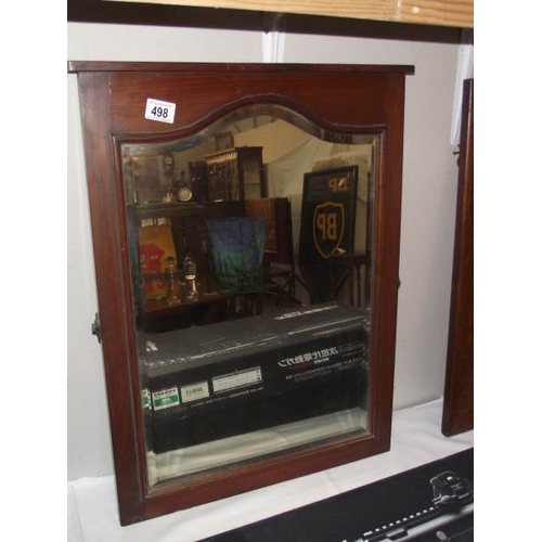 498 - An Edwardian oak bevel edge mirror